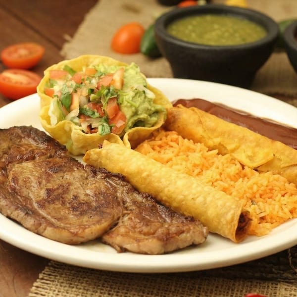 El Cerro Grande's grilled steak, flautas, rice, and taco salad with guacamole and salsa.