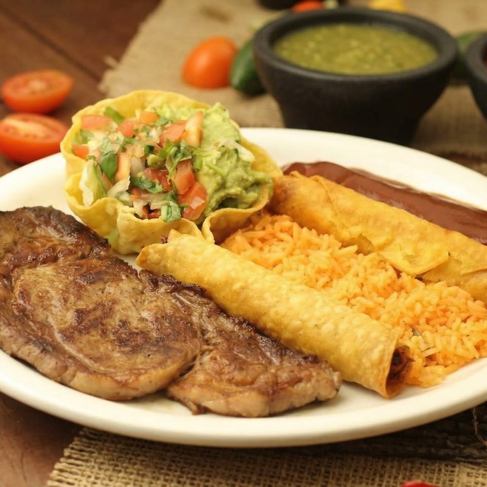 El Cerro Grande's grilled steak, flautas, rice, and taco salad with guacamole and salsa.